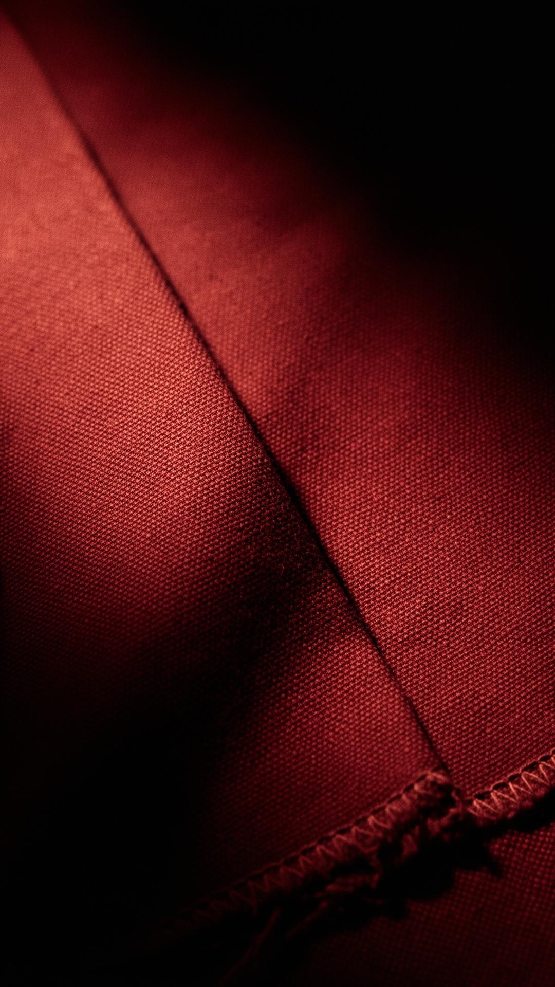 Macro of heavyweight cotton fabric with hand-finished hem